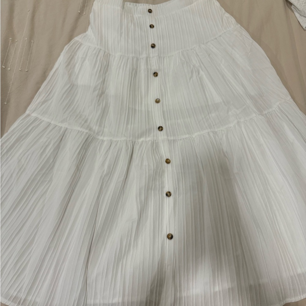 Elegant White Pleated Skirt with Button Detail